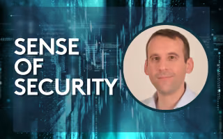 'sense of security' circular headshot of man in a blue shirt
