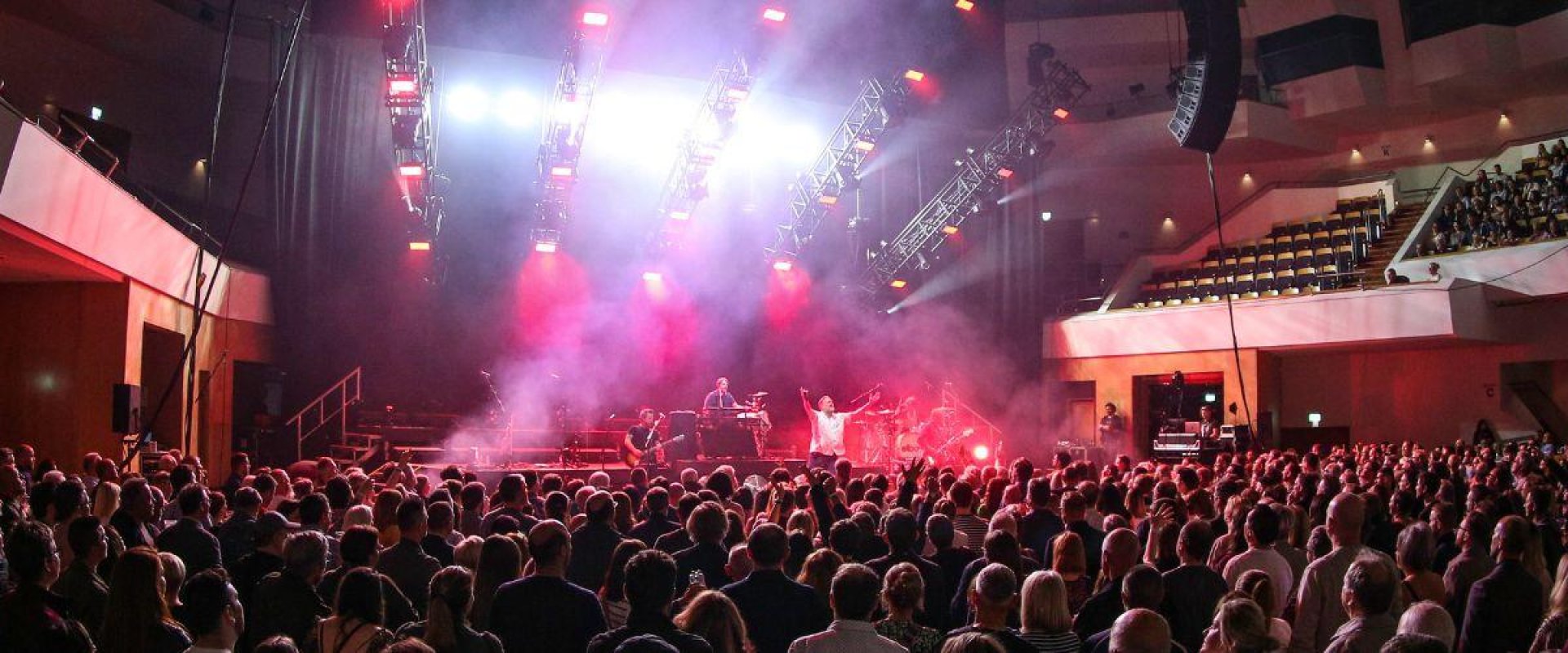 Rock band Elbow play on stage at the Waterfront Hall, Main Auditorium with hundred of people in the crowd facing forward