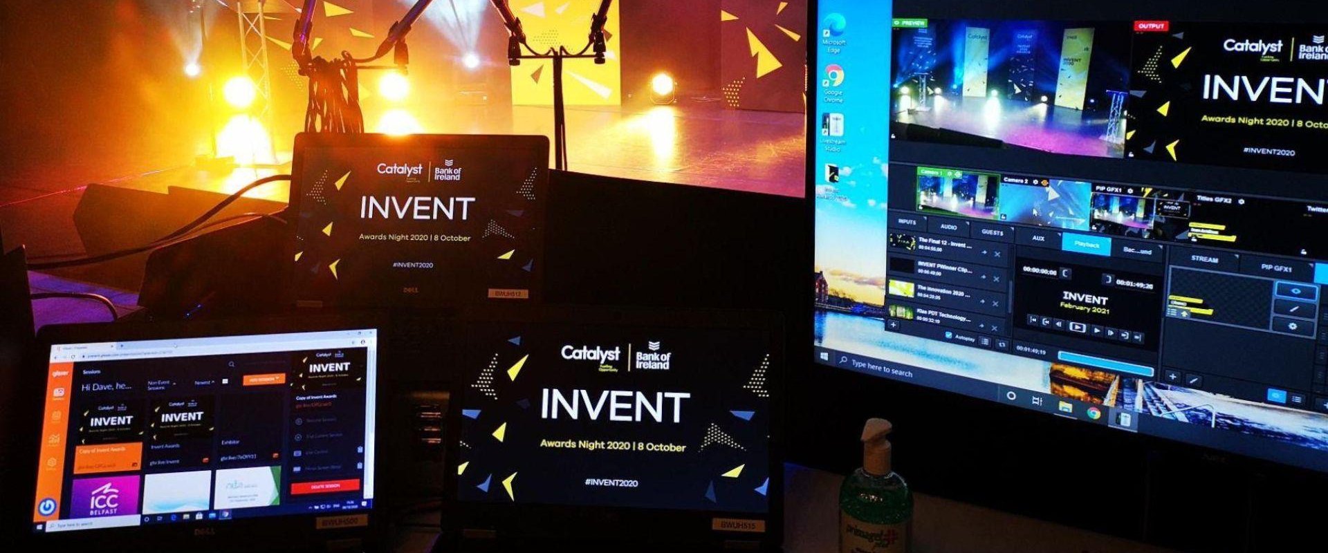 Event production set up for the Invent 2020 awards in ICC Belfast's Hybrid Studio. Multiple screens are visible with the stage in the background lit with yellow lights.