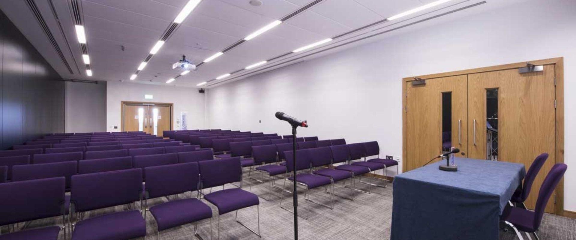 Picture shows ICC Belfast, meeting room two theatre style room with purple chairs