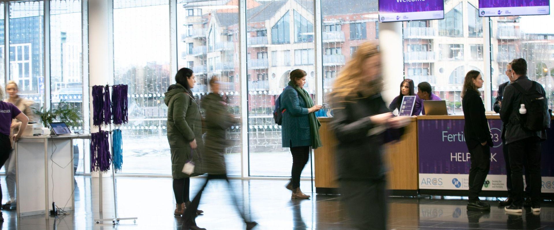 Delegates registering for The Joint Fertility Conference 2023 in ICC Belfast's Riverside Foyer