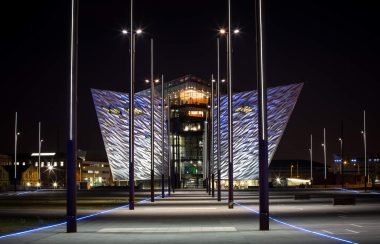 View of Titanic Belfast at night from the maritime mile walkway