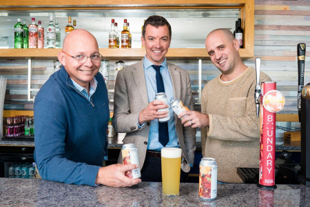 3 Men holding Boundary Beers