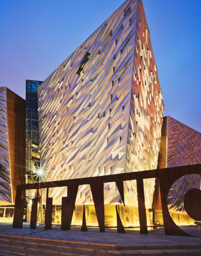 An image of the Titanic Belfast venue lit up at night