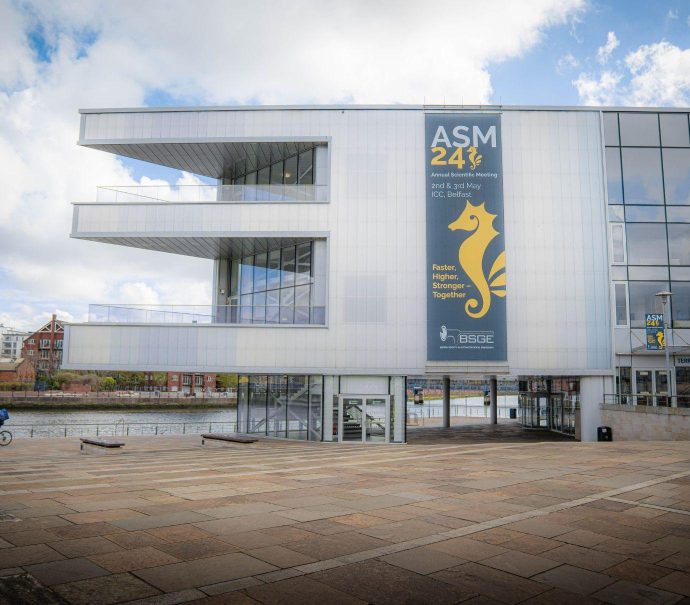Exterior image with BSGE ASM 2024 branding displayed on the side of the venue