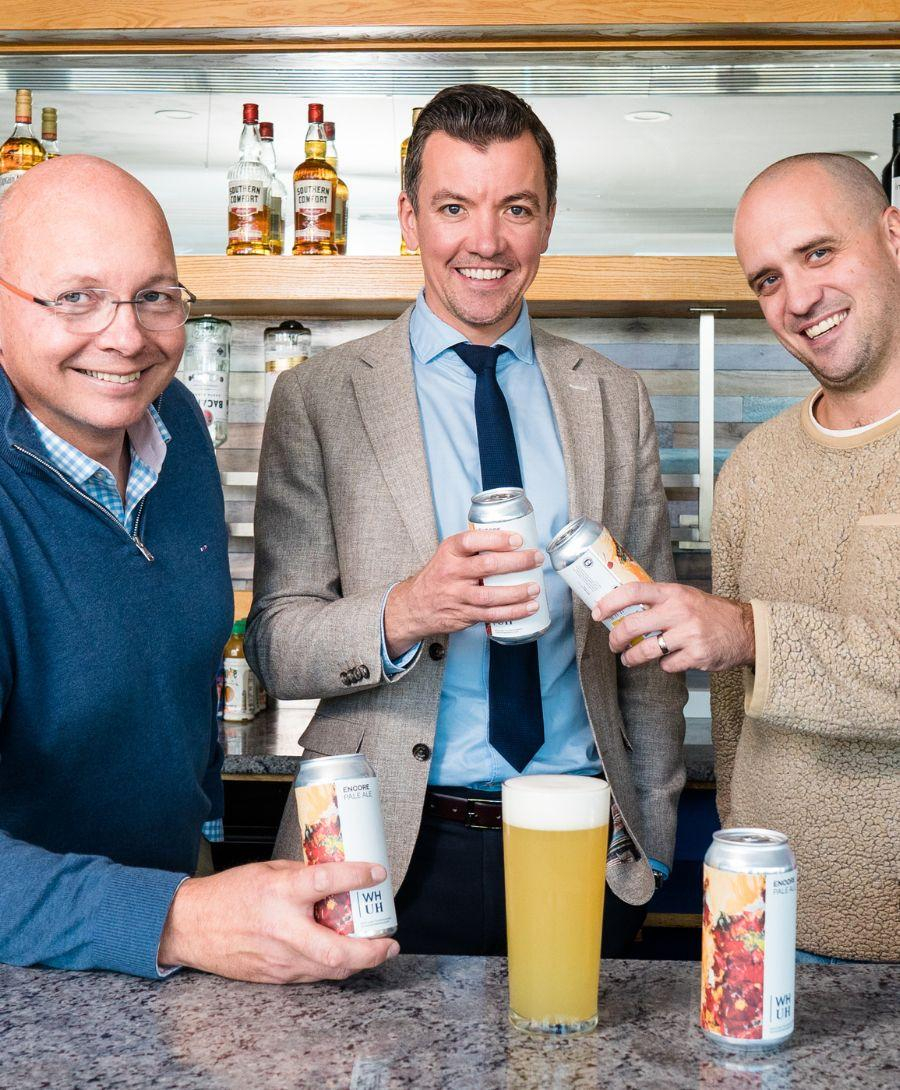 3 Men holding Boundary Beers