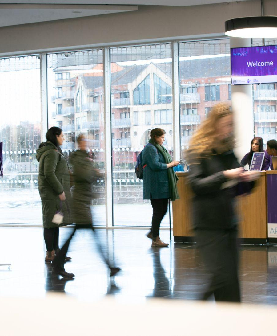 Delegates registering for The Joint Fertility Conference 2023 in ICC Belfast's Riverside Foyer