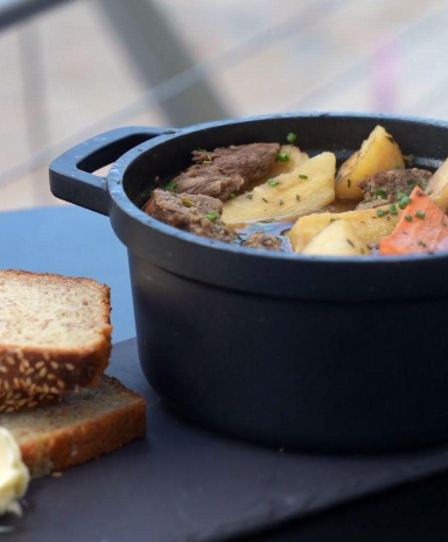 Traditional Irish stew presented with wheaten bread and butter