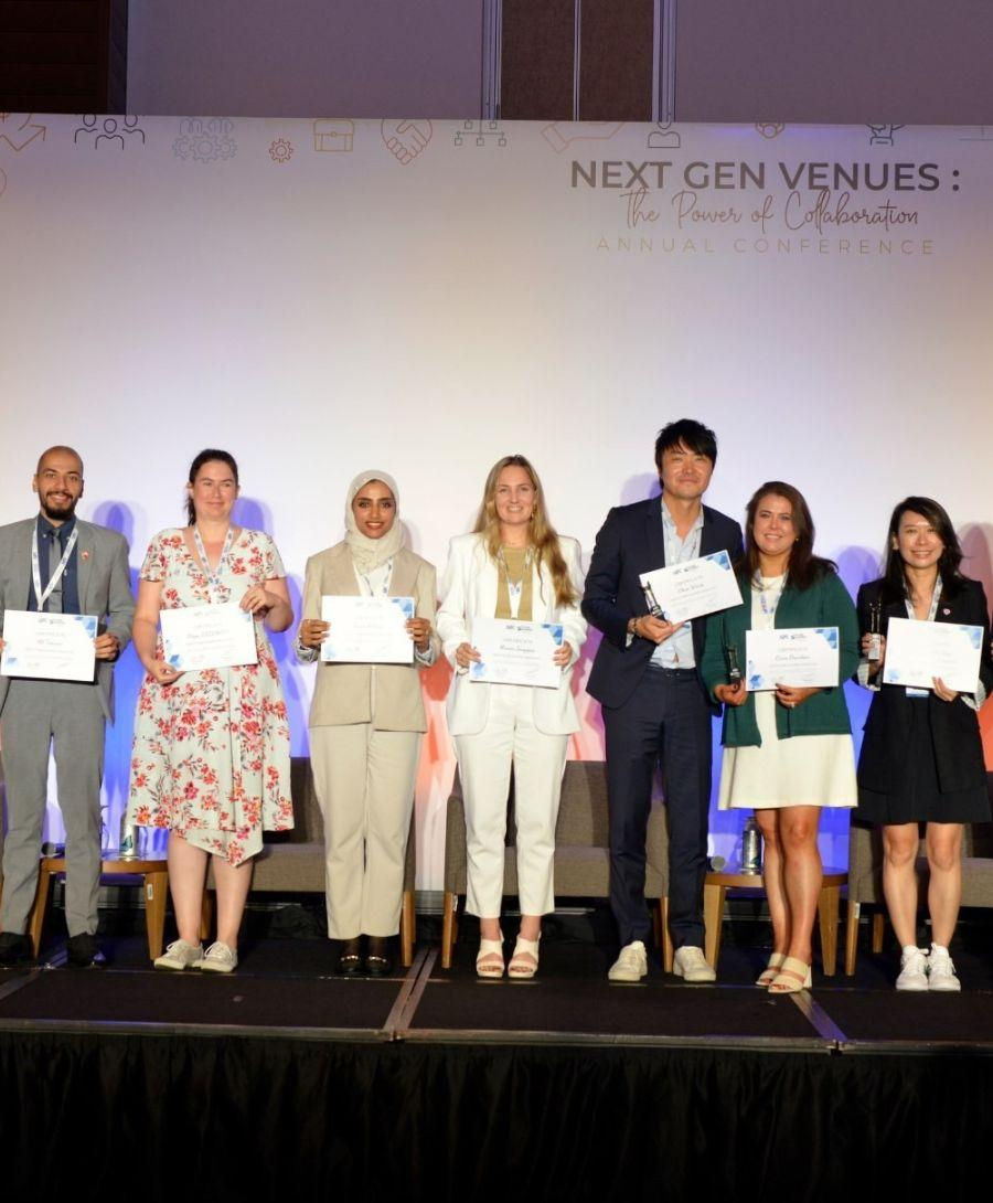 AIPC participants photographed on stage in Costa Rica.