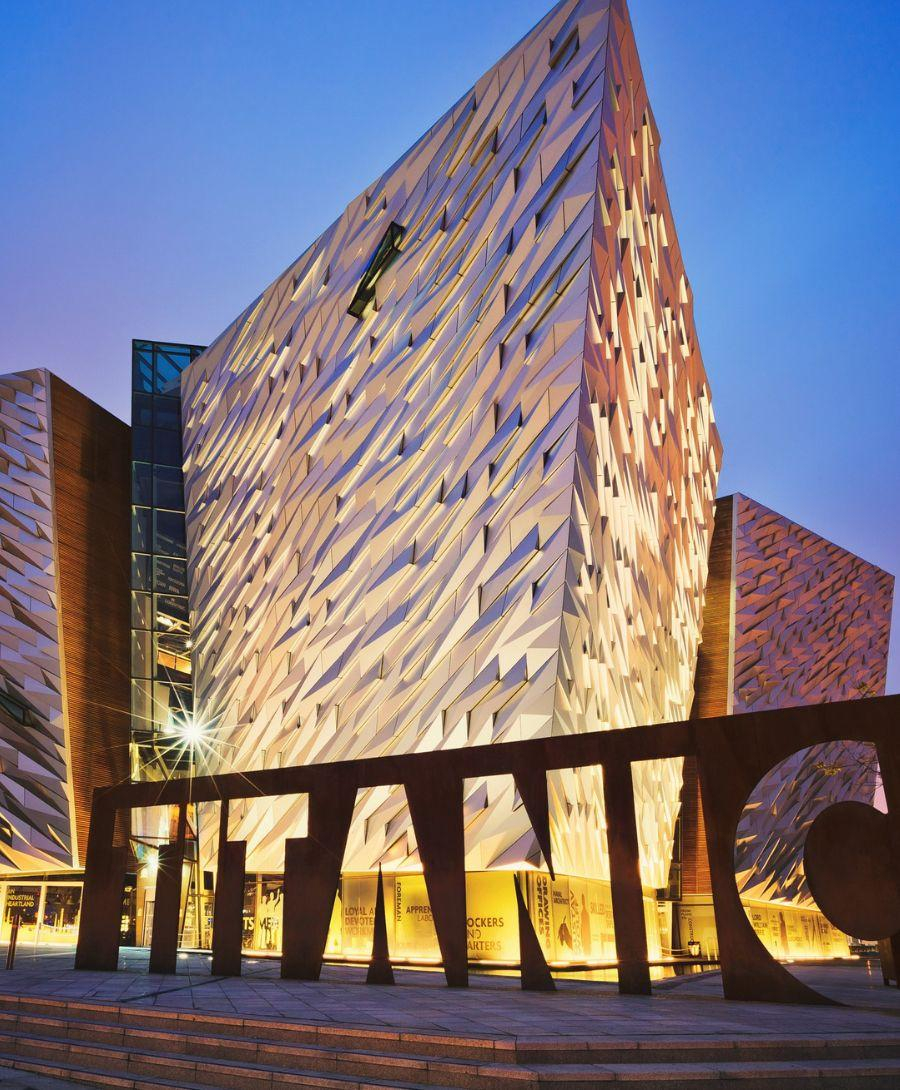 An image of the Titanic Belfast venue lit up at night
