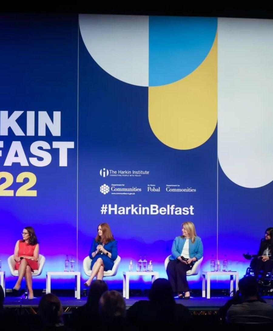 Dr Joseph Jones, Executive Director at Harkin Institute waved on stage to people in the crowd