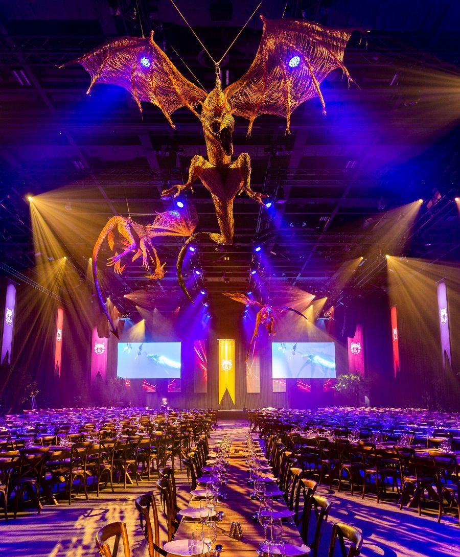 Image showcase AstraZeneca Gala Dinner in Hall 1 with Game of Thrones dragon installation hanging from roof