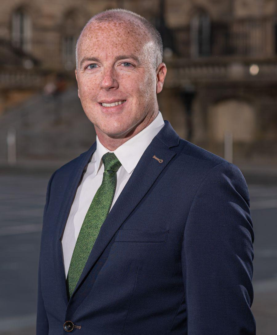 Seen in this picture is a headshot of Conor Houston