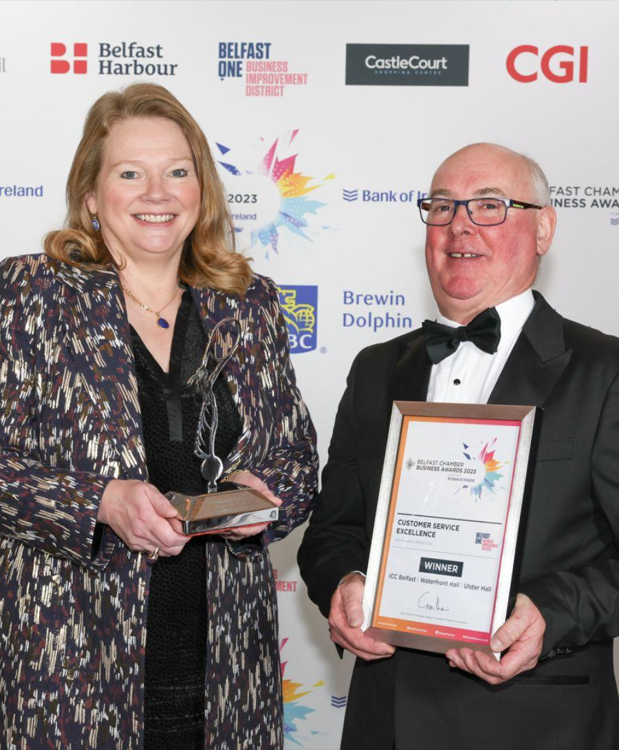 Julia Corkey, Chief Executive at ICC Belfast and Wilson Walker, Chairman of Belfast One Board at Belfast Chamber Awards 2023 accepting award for Customer Service Excellence