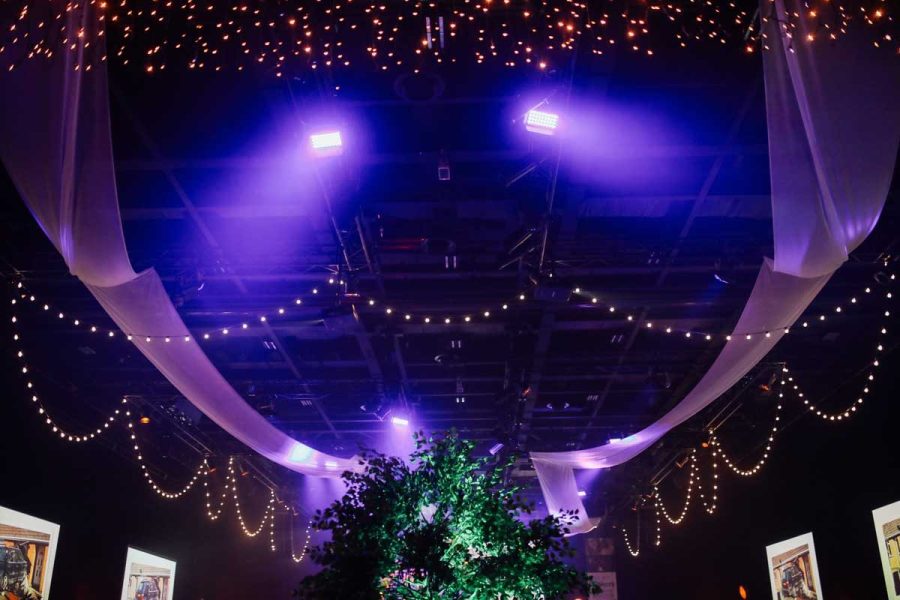 Hall one, black draped dressed room with beaming pink light