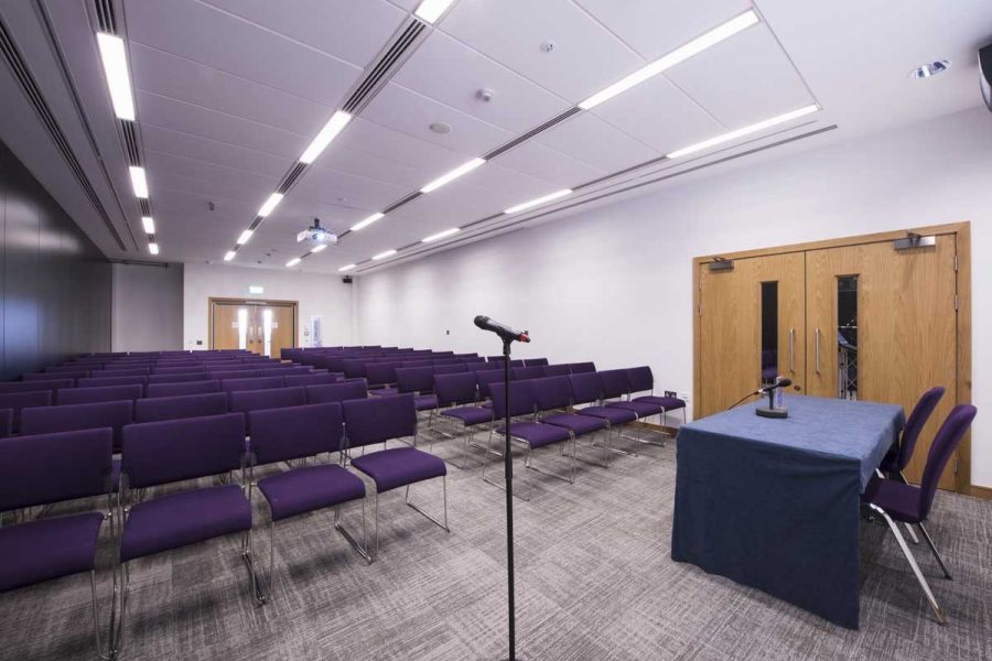 Picture depicts ICC Belfast, meeting room two theatre style room with purple chairs