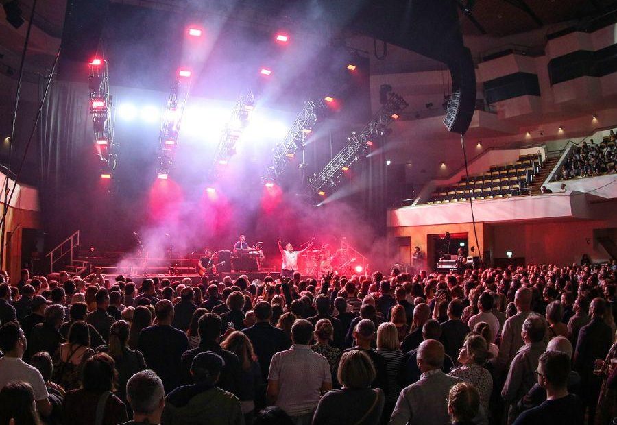 Rock band Elbow play on stage at the Waterfront Hall, Main Auditorium with hundred of people in the crowd facing forward