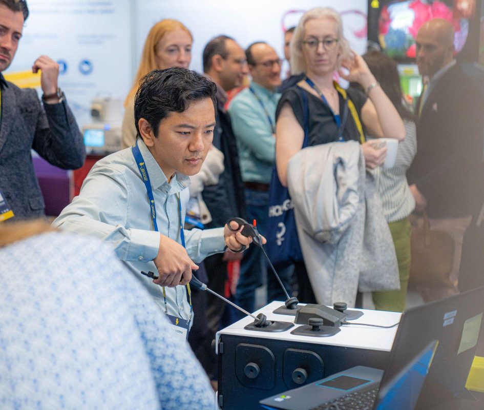 Delegate demonstrates simulation using equipment displayed at the BSGE 2024 conference in Hall 2 at ICC Belfast