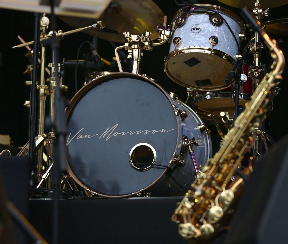 Close-up image of a drum kit and saxophone with Van Morrison branding displayed on the main drum